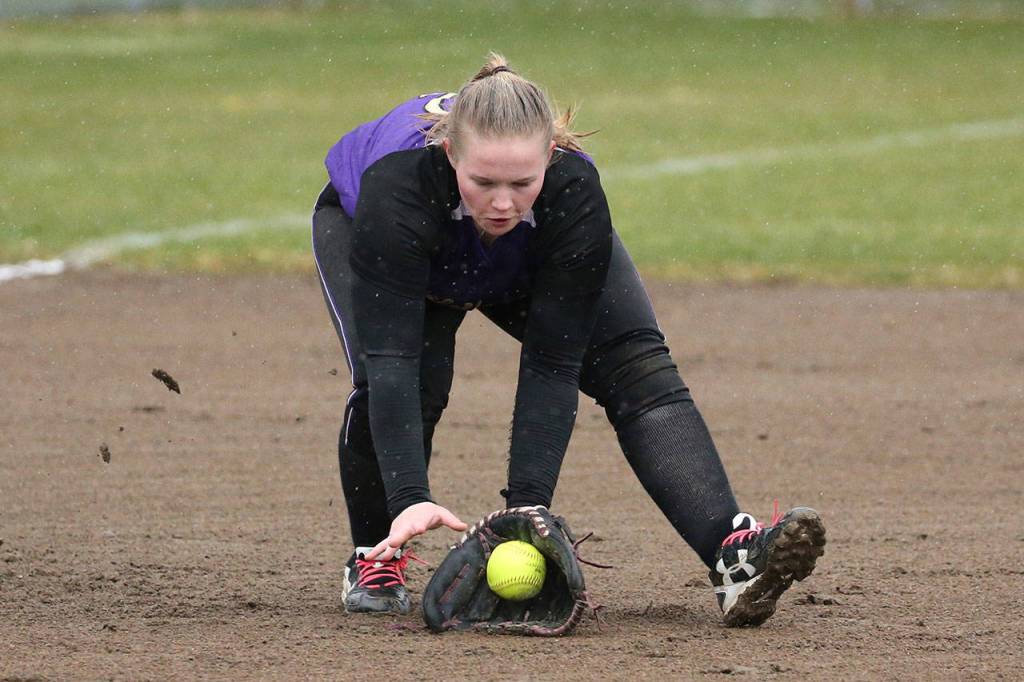 Eleanor Tucker scoops up a grounder in the Mariner game Tuesday.(Photo by John Fisken)