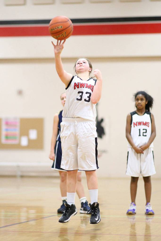 Seventh-graders Jillian Knoll (33) and Nerya Rennes (12).(Photo by John Fisken)