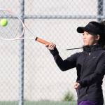 Katrina Martinez smacks a forehand in second doubles Thursday.(Photo by John Fisken)