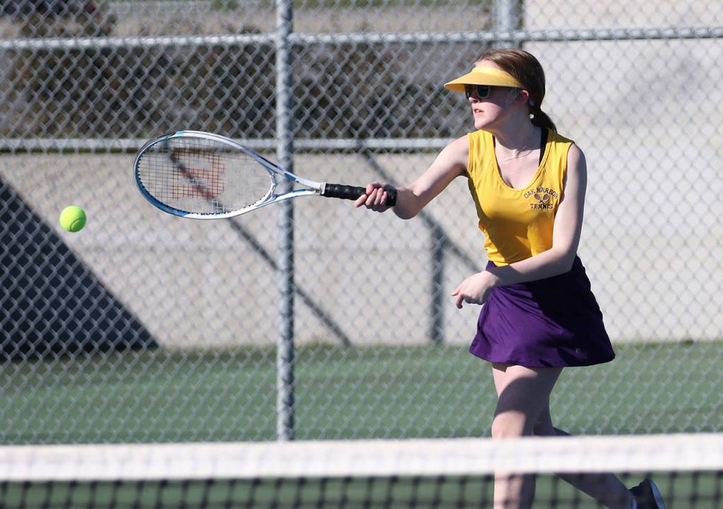 Johanna Schmidt volleys in second doubles Thursday.(Photo by John Fisken)
