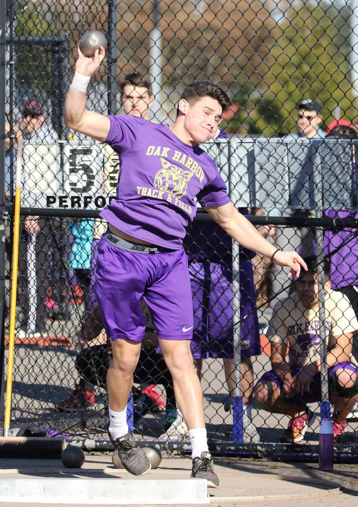 Oak Harbors Isaac Gomez wins the shot put for the Wildcats.(Photo by John Fisken)