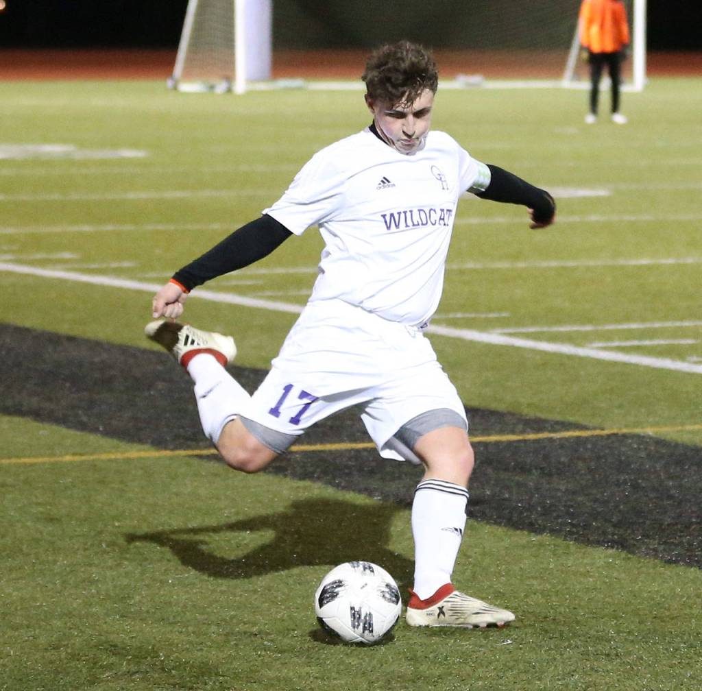 Andrew Eaton takes a free kick for the Wildcats.(Photo by John Fisken)