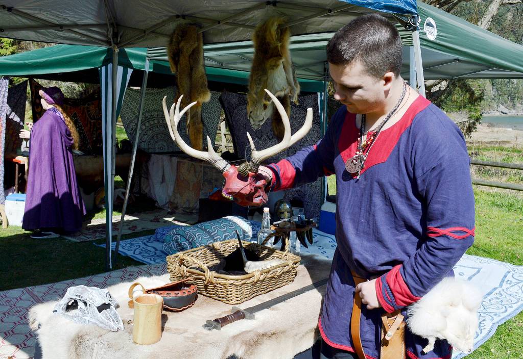 Photo by Laura Guido/ Whidbey News Group                                Kori Speece, leader of the local Iron Eagle Island chapter, holds up the groups relic. The Viking-themed group is represented by a stag skull.
