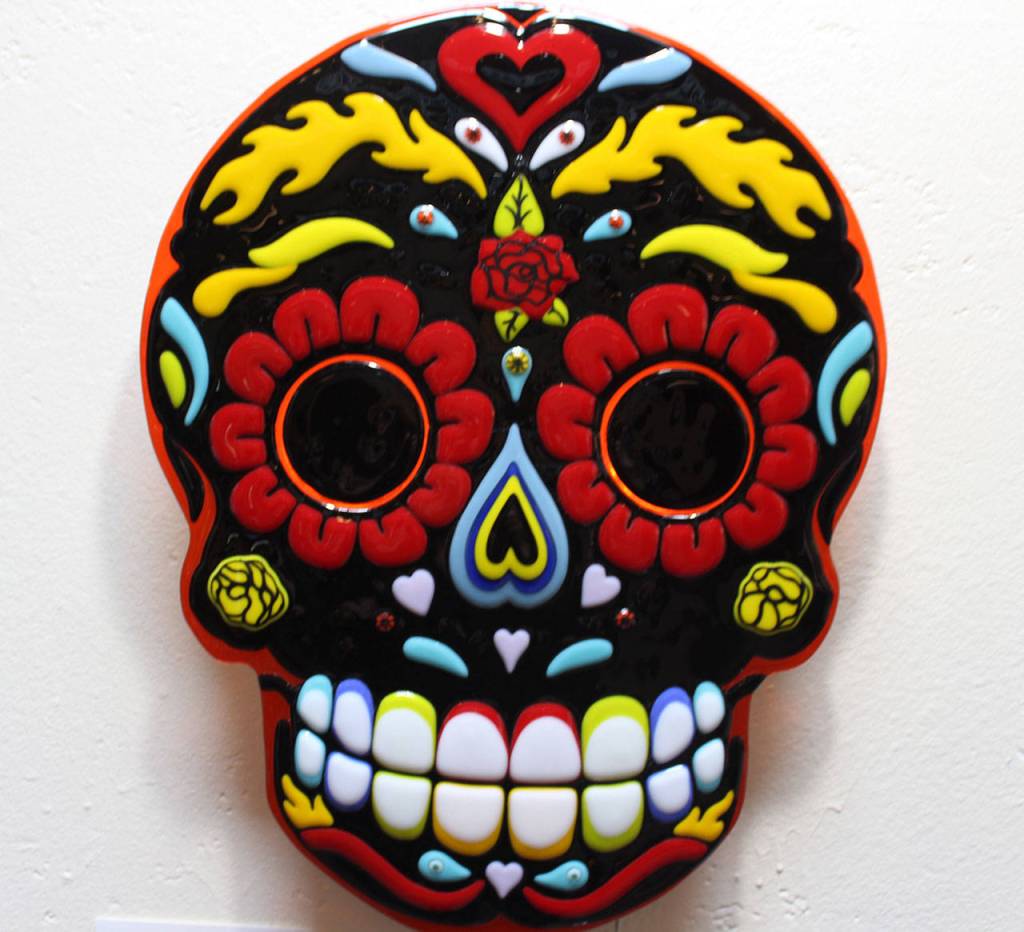 Gina Michels exhibit contains a few fused glass images of masks, including this Day of the Dead skull.