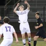 Nathan Merrill advances the ball with a header against Lynnwood.(Photo by John Fisken)