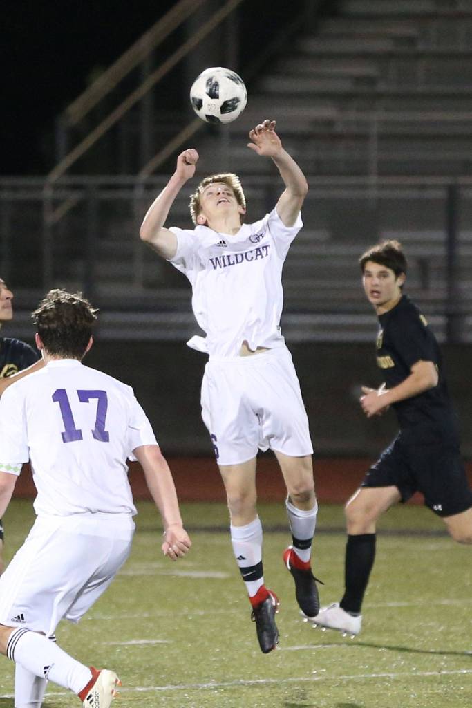 Nathan Merrill advances the ball with a header against Lynnwood.(Photo by John Fisken)