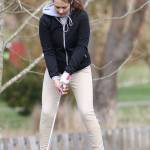 Makenna Ronning prepares to tee off for the Wildcats.(Photo by John Fisken)