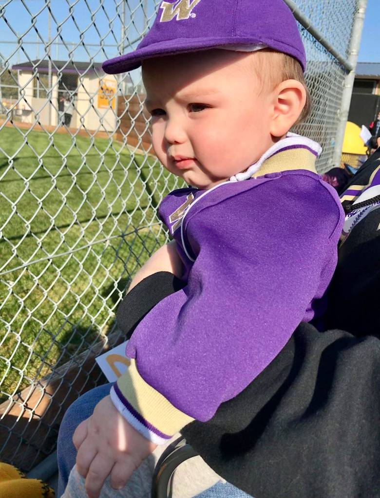 Future Wildcat Noe Scott Ochoa takes in his first game Tuesday. Noe was there to watch uncle James Besaw play for Oak Harbor. (Photo by mommy Mackenzie Nichols)