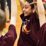 David Ybarra celebrates with his Crescent Harbor reading team Tuesday after they won the semi-final competition of the third grade reading challenge. Photo by Laura Guido/Whidbey News Group