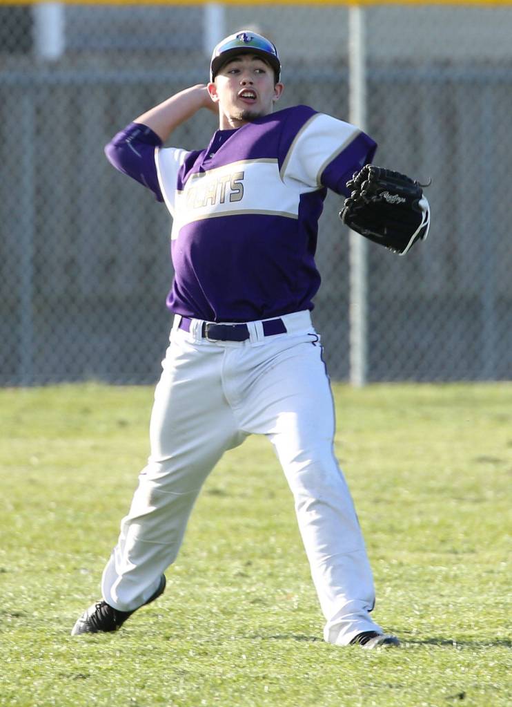 Outfielder Taylor Rummel fires the ball back into the infield in Fridays game with M-P.(Photo by John Fisken)