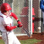 Nick Etzell puts the ball in play for Coupeville Friday. (Photo by John Fisken)