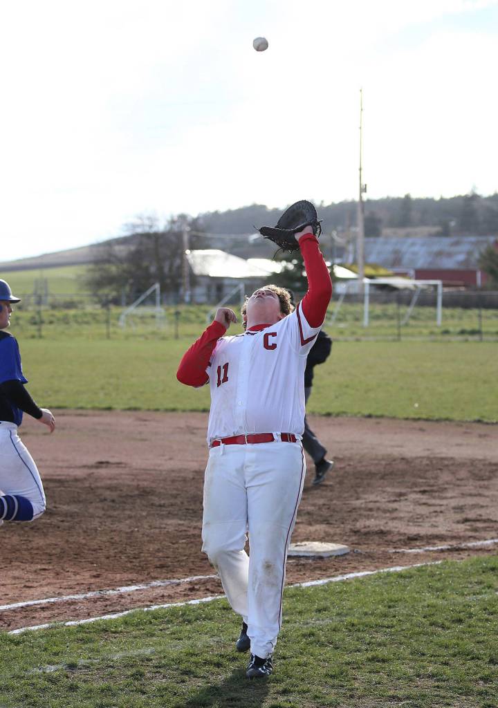 First baseman Julian Welling settles under a pop-up Friday.(Photo by John Fisken)