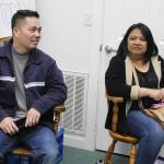 Parents Phat Tang and Arllien Guerrero watch their respective sons practice their Korean martial arts routine Saturday at a coaching session. The boys met learning taekwondo and came up with their routine, Five Finger Death Punch, together.
