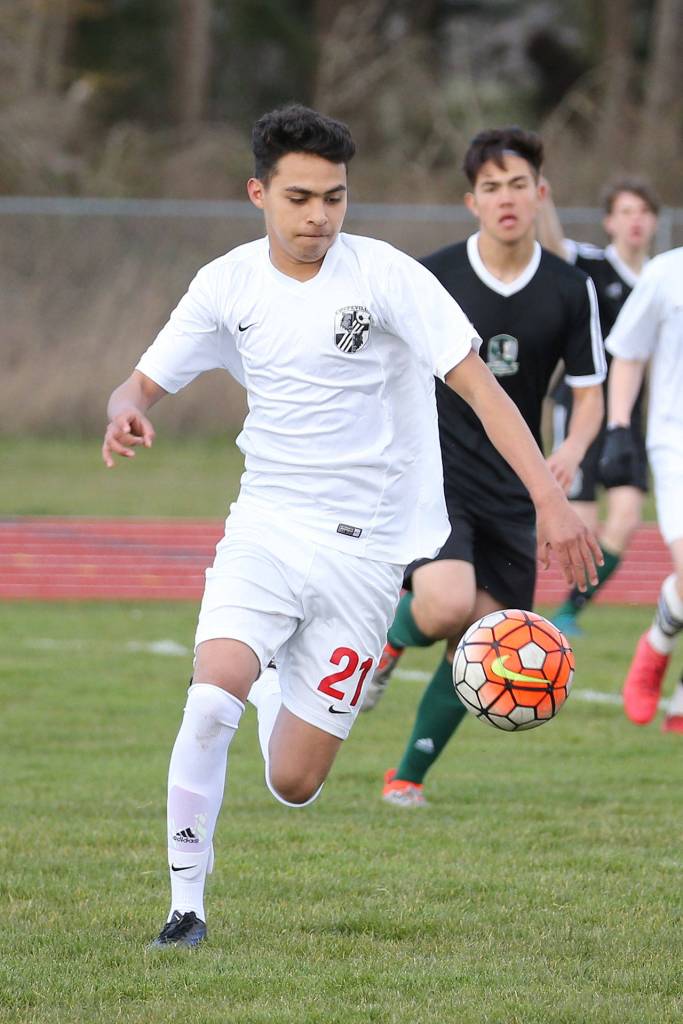 Derek Leyva pushes the ball up the field for Coupeville.(Photo by John Fisken)