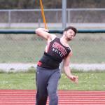 Chris Battaglia tosses the javelin for the Wolves. (Photo by John Fisken)