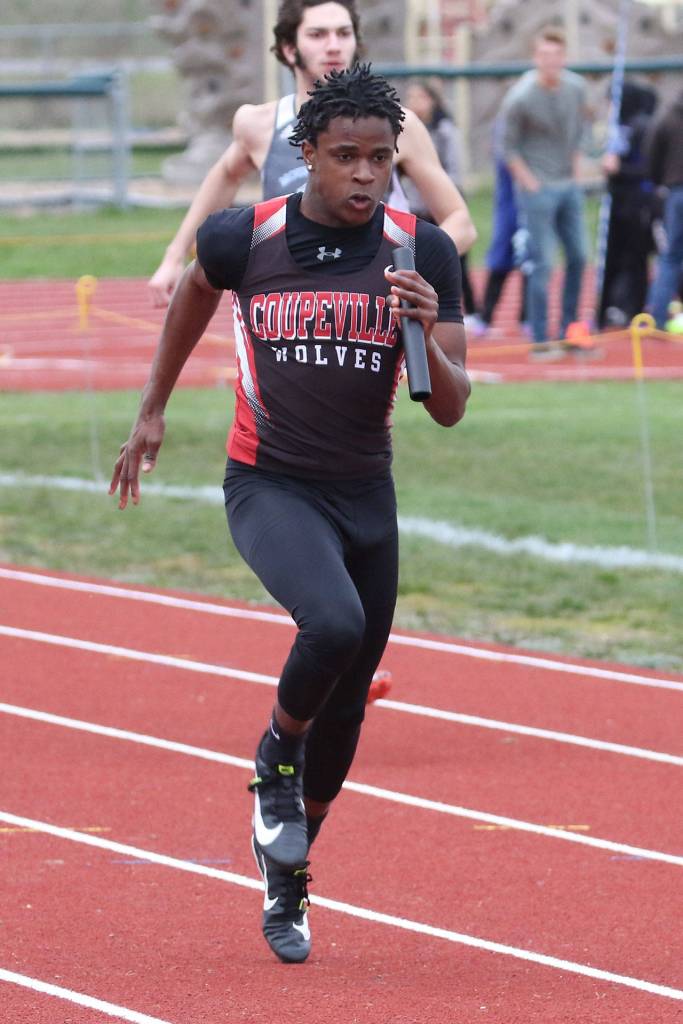 Jean Lund-Olsen competes in the 4x100 relay for Coupeville. (Photo by John Fisken)