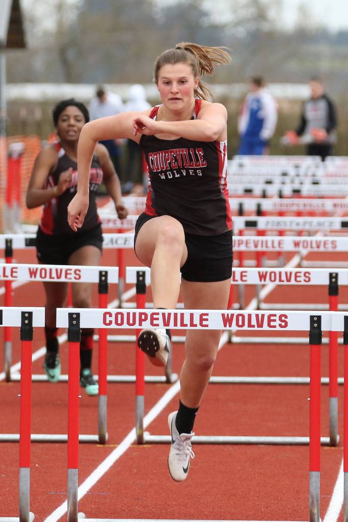 Lindsey Roberts runs to second place in the 100 hurdles.(Photo by John Fisken)