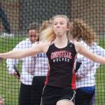 Allison Wenzel flips the discus in Coupevilles track meet Wednesday. (Photo by John Fisken)