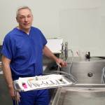 Photo by Jessie Stensland / Whidbey News-Times                                Island County Coroner Robert Bishop prepares for an autopsy.