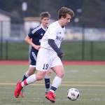 Eric Closson advances the ball for Oak Harbor Monday. (Photo by John Fisken)