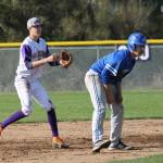 Oak Harbor shortstop Joe Dixon, left, keeps a Shorewood runner close at second.(Photo by Jim Waller/Whidbey News-Times)