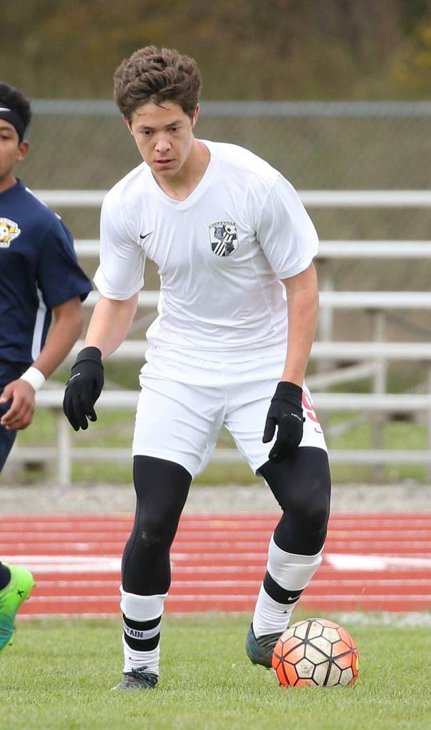 William Nelson controls the ball for the Wolves in the match with Forks.(Photo by John Fisken)