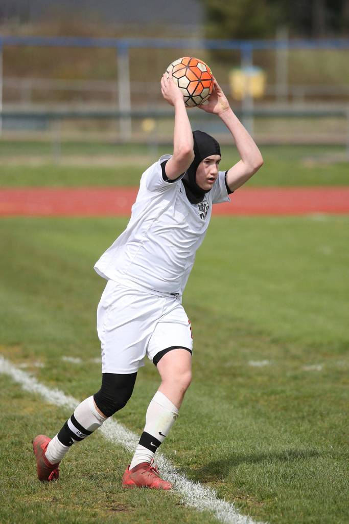 Ethan Spark tosses the ball in play Saturday.(Photo by John Fisken)
