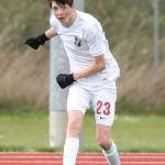 James Wood punches the ball forward for the Wolves.(Photo by John Fisken)