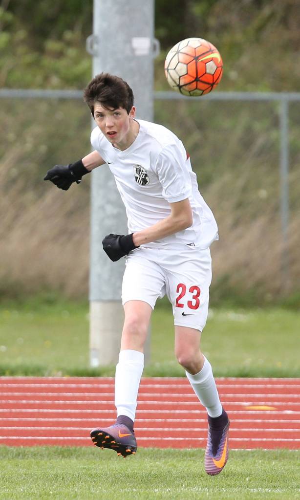 James Wood punches the ball forward for the Wolves.(Photo by John Fisken)