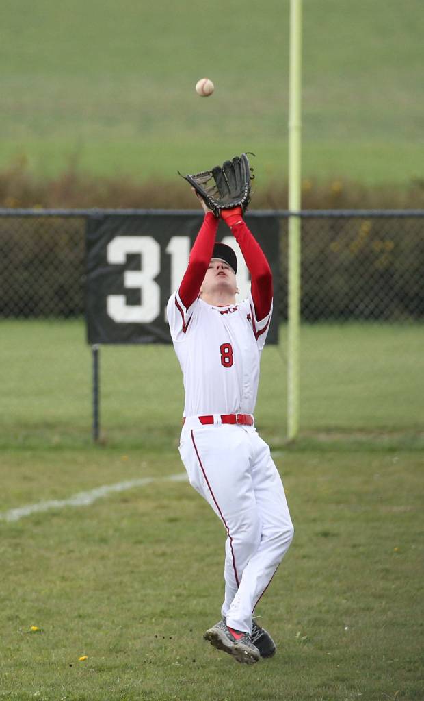 Left fielder Jake Hoagland looks in a fly ball Saturday.(Photo by John Fisken)