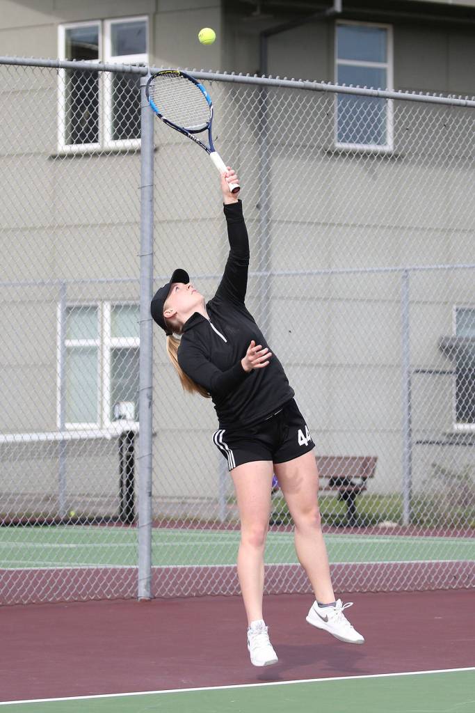 Coupevilles Sage Renninger serves during the first doubles match with North Kitsap.(Photo by John Fisken)