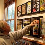 Richard Marquis looks over the arrangement of his Found Objects installation at Bayview Corners Front Room Gallery. A Freeland glass artist with pieces in galleries worldwide, hes also collected vintage advertising and other items. Photo by Patricia Guthrie/Whidbey News Group