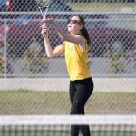 Danielle Lonborg serves in her first doubles match.(Photo by John Fisken)