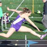 Oak Harbors Samantha Hines runs to first place in the 300 hurdles Thursday. She also won the 100 hurdles earlier in the meet at Mount Vernon. (Photo by John Fisken)