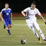 Jeremy NunoAcosta beats a Shorewood player to the ball in Fridays soccer match.(Photo by John Fisken)