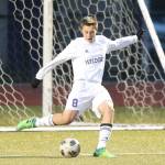 Ridgely Briddell boots the ball for Oak Harbor in Fridays match with Shorewood. Coach Jeff Laiblin lauded Briddells defensive work in the contest. (Photo by John Fisken)
