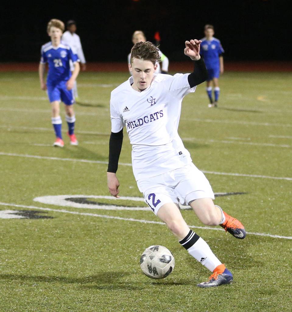 Brandon McCracken advances the ball for the Wildcats Friday.(Photo by John Fisken)