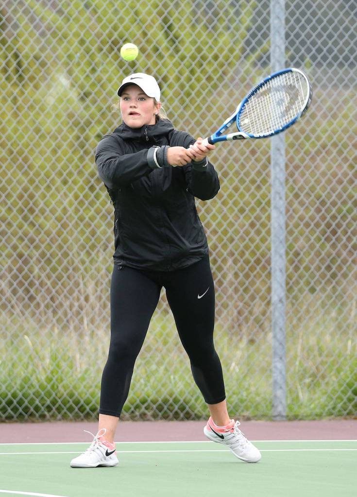 Genna Wright hits a backhand during her match in second singles.(Photo by John Fisken)