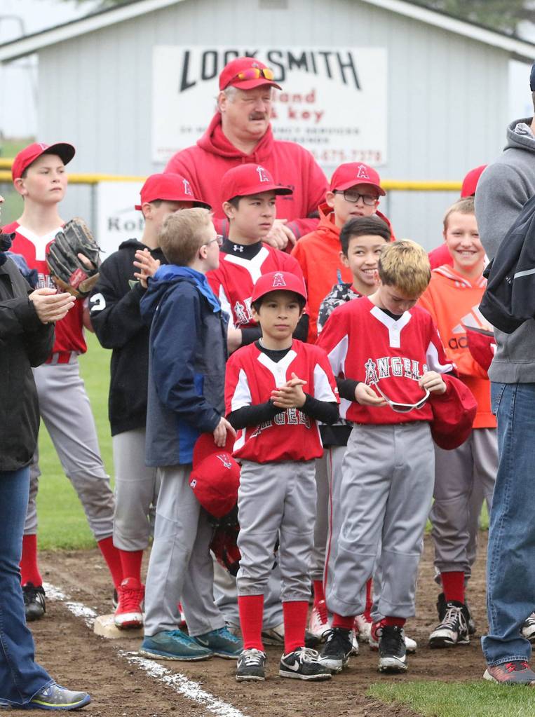 The Angels take in the opening day ceremonies.(Photo by John Fisken)