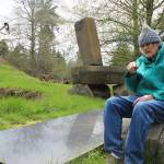 Hank Nelson sits near one of his installations at Cloudstone Sculpture Park, a 20-acre display near Freeland of his stone and steel work. Nelson and artist Sue Taves are being honored April 21 during International Sculpture Days. Photos by Patricia Guthrie/Whidbey News Group