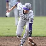 Oak Harbor shortstop Joe Dixon scoops up a slow roller in Tuesdays game.(Photo by John Fisken)