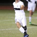 Kanoa King pushes the ball ahead for the Wildcats.(Photo by John Fisken)