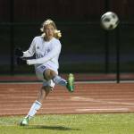 Mason Rhodes takes a corner kick for Oak Harbor.(Photo by John Fisken)