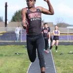 Jean Lund Olsen flies to fourth place in the long jump.(Photo by John Fisken)