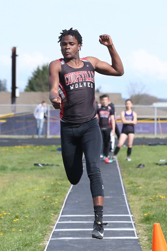 Jean Lund Olsen flies to fourth place in the long jump.(Photo by John Fisken)