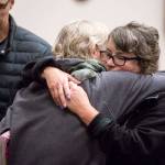 Tiffany Ferrians (right) hugs Tamara Fralic after two former Island County corrections officers were sentenced on Tuesday at the Whatcom County Courthouse in Bellingham over the death of Keaton Farris. Ferrians is the mother of Harris. Fralic is Farris aunt. (Andy Bronson / The Herald)