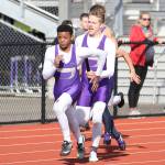 Andrew Miller, right, hands off to Dorian Hardin in Oak Harbors winning effort in the 4x100 relay.(Photo by John Fisken)