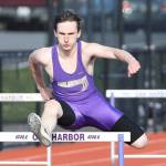 Gabriel Daggett runs to second place in the 300 hurdles. Earlier in the meet he won the 110 hurdles.(Photo by John Fisken)