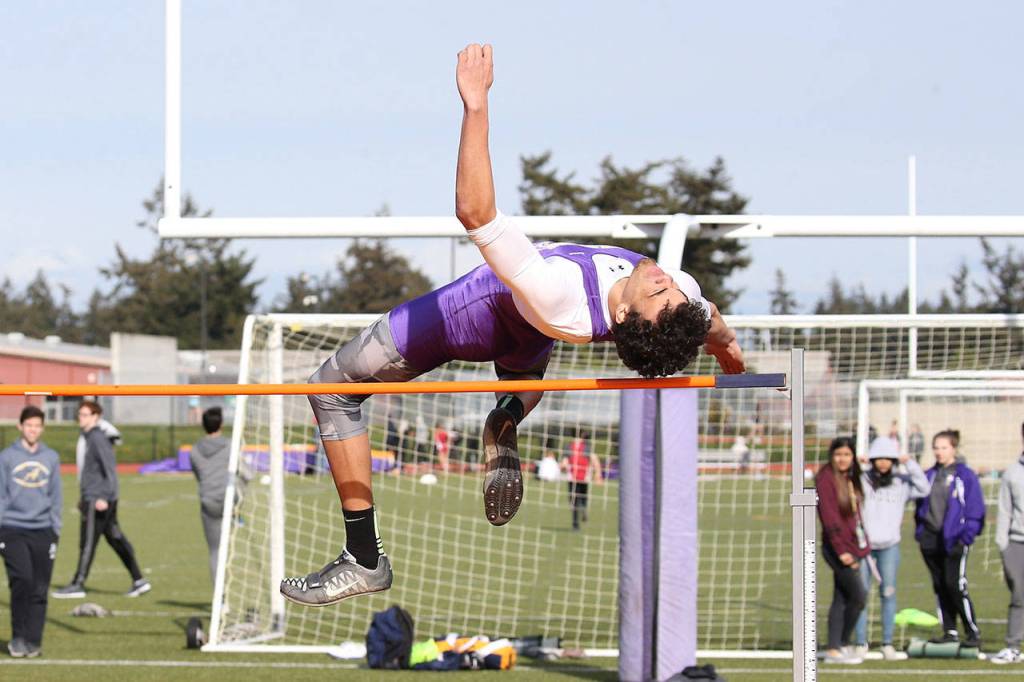 Ozell Jackson wins the high jump in the three-team meet Thursday.(Photo by John Fisken)