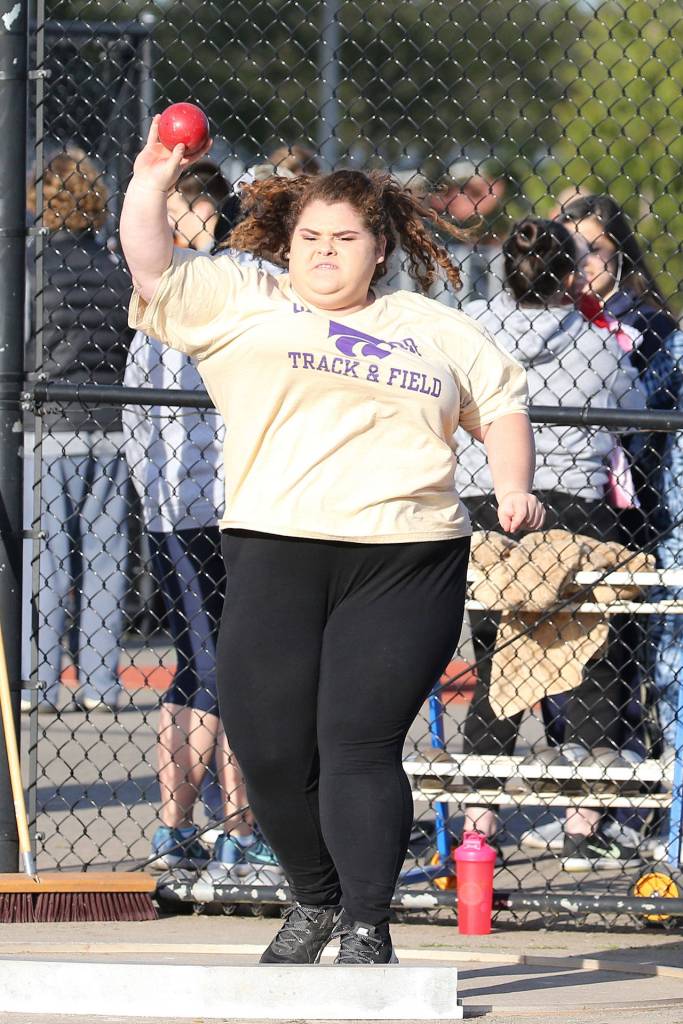 Sarah Ulam takes fifth place in the shot put to lead the Oak Harbor athletes in the event.(Photo by John Fisken)